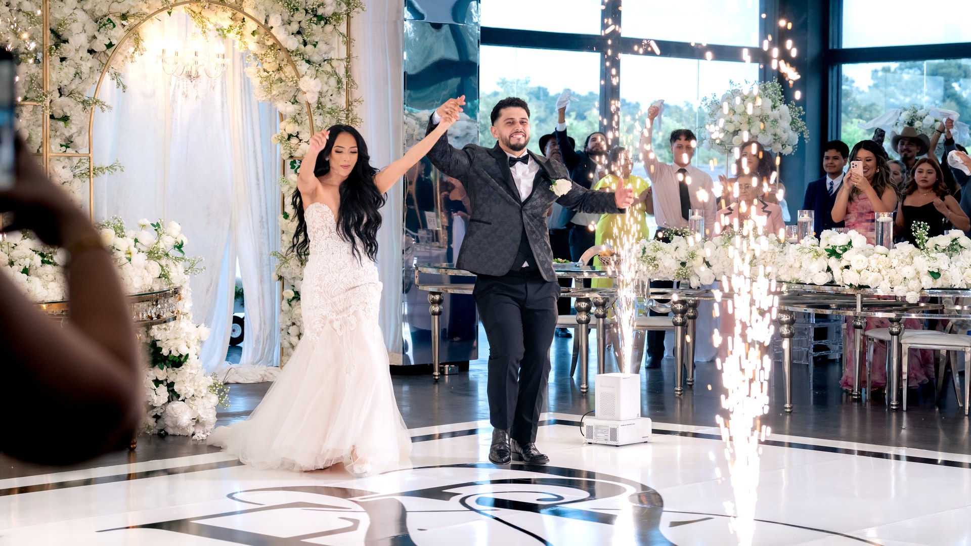 Couple grand entrance with sparklers on dance floor