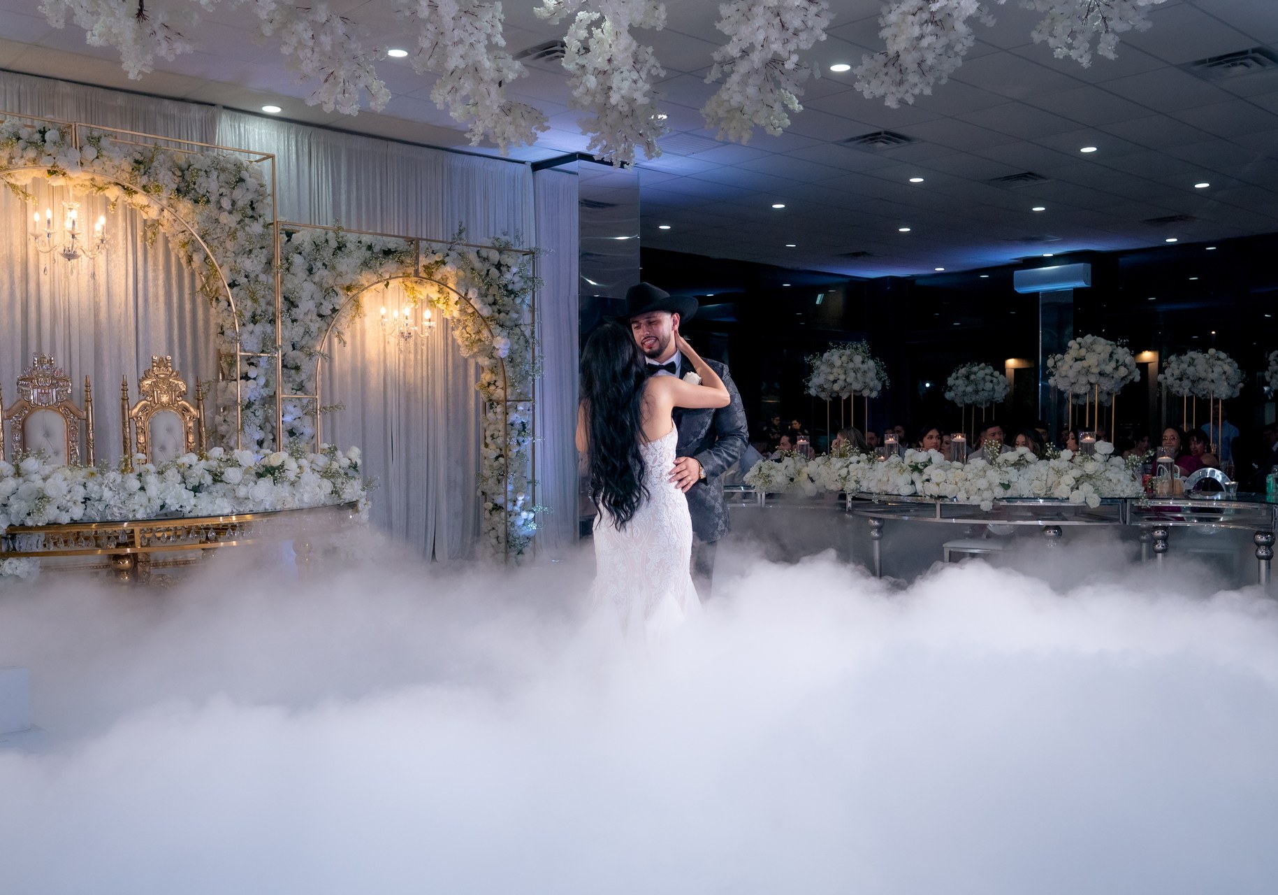 Couple dancing on fog-covered dance floor