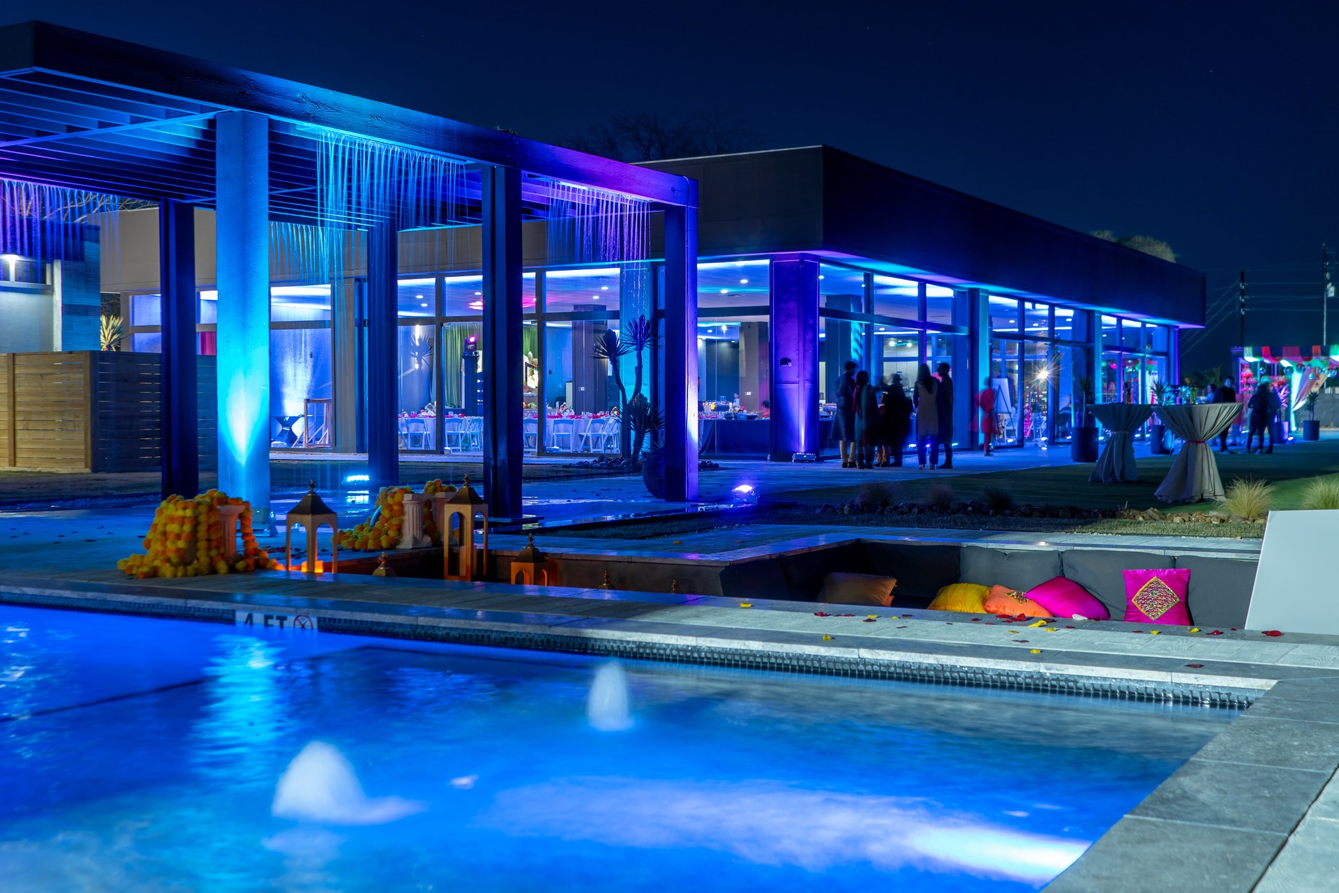 AG Outdoor Venue at night with blue and purple pool lighting