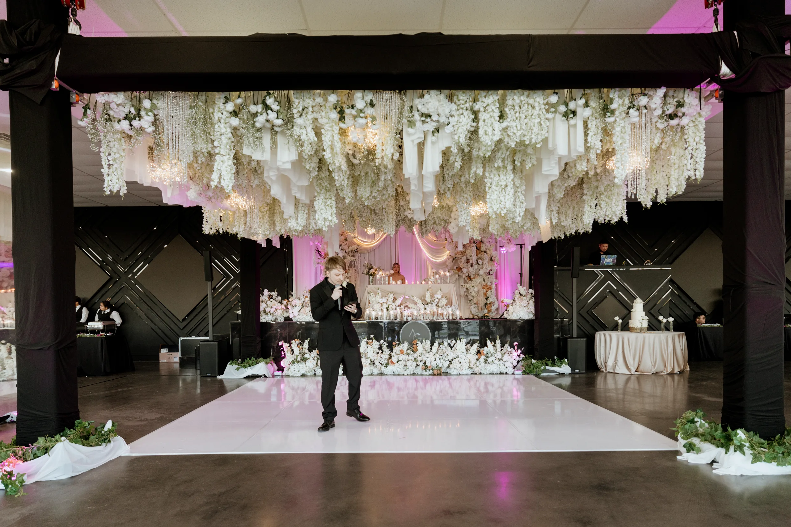Quinceañera in a ball gown beside the pool at AG Outdoor Venue in Tomball, Texas